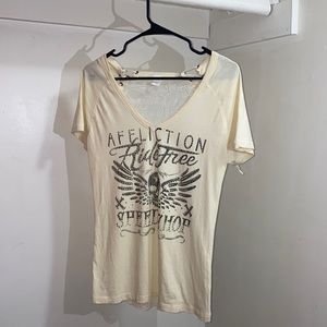 cream colored affliction shirt
